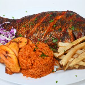 Grilled Tilapia Fish: with side of jollof rice or fried rice, coleslaw and plantain